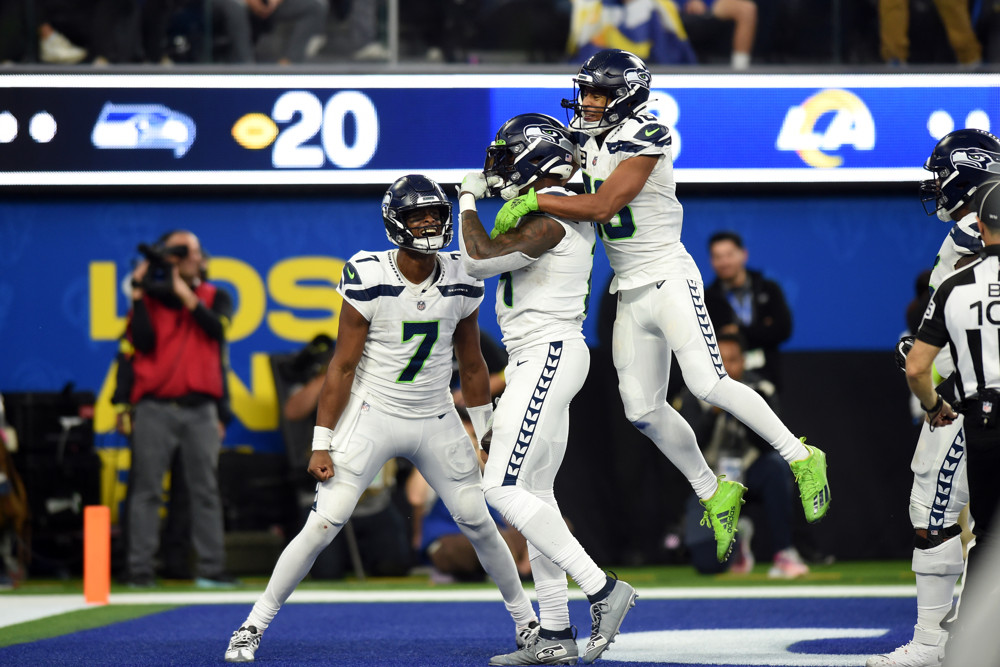 INGLEWOOD, CA - DECEMBER 04: Seattle Seahawks wide receiver DK Metcalf (14) celebrates with Seattle Seahawks wide receiver Tyler Lockett (16) and Seattle Seahawks quarterback Geno Smith (7) after catching a pass for the go-ahead touchdown in the fourth quarter during an NFL game between the Seattle Seahawks and the Los Angeles Rams on December 04, 2022, at SoFi Stadium in Inglewood, CA. (Photo by Chris Williams/Icon Sportswire)