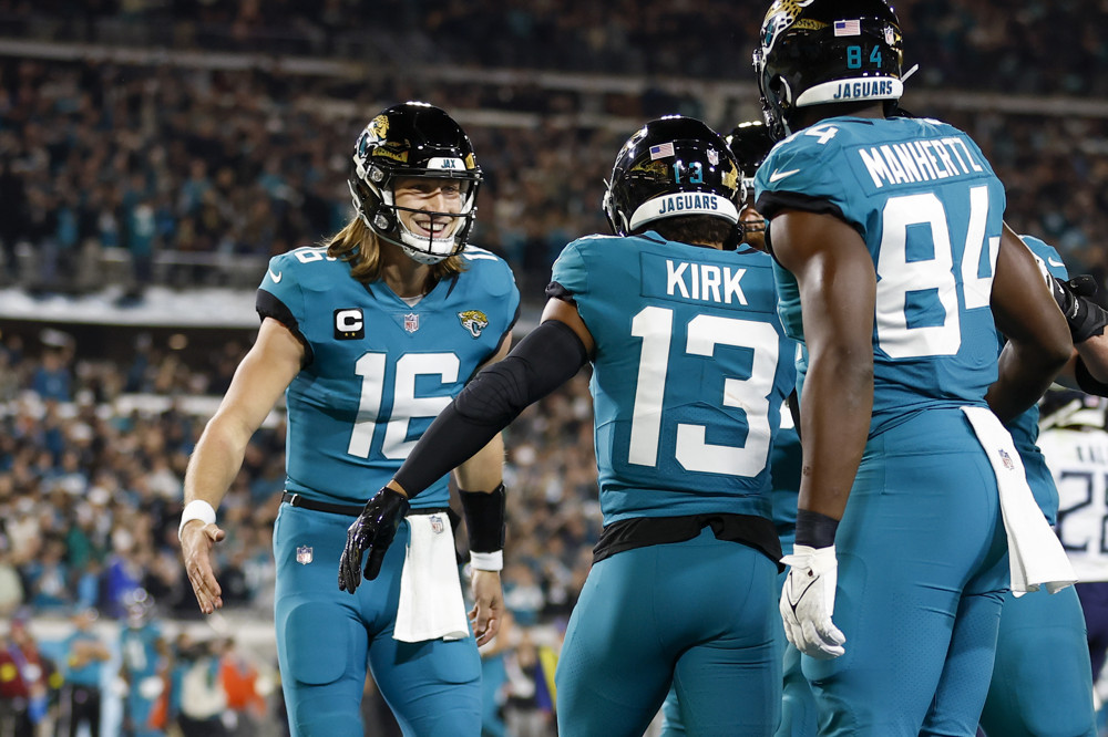 JACKSONVILLE, FL - JANUARY 07: Jacksonville Jaguars quarterback Trevor Lawrence (16) celebrates a touchdown with Jacksonville Jaguars wide receiver Christian Kirk (13) during the game between the Tennessee Titans and the Jacksonville Jaguars and the on January 7, 2023 at TIAA Bank Field in Jacksonville, Fl. (Photo by David Rosenblum/Icon Sportswire)